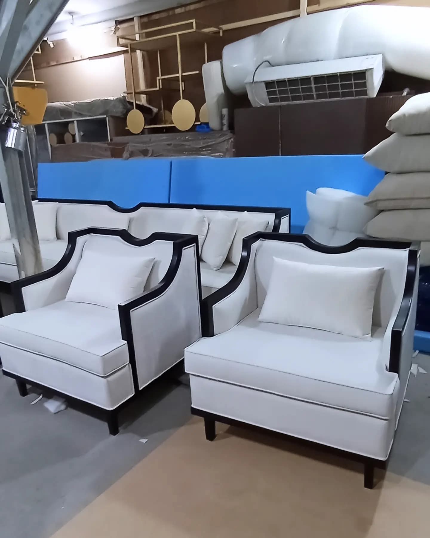 Upholstered armchairs being made at the workshop