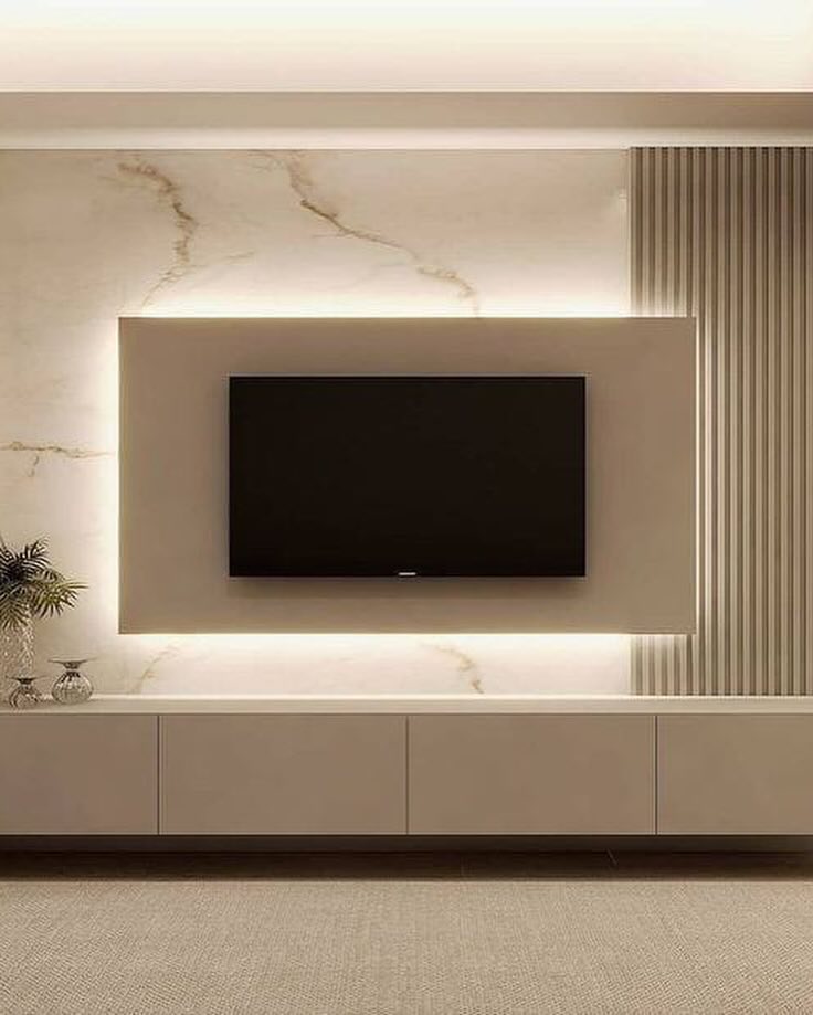 Backlit marble TV feature wall with floating cabinetry