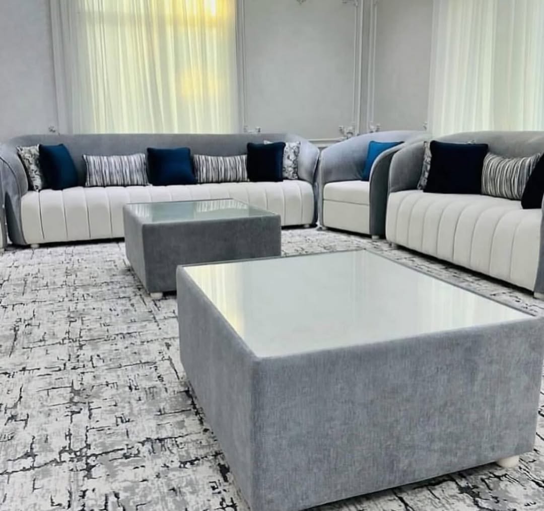 Grey velvet sofa set with glass-top coffee tables