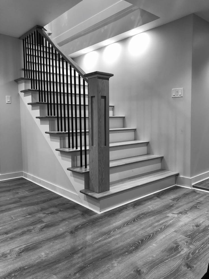 Staircase joinery with wood treads and painted balusters